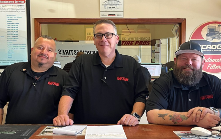 Ed Whitehead's Tire Pros team at the counter